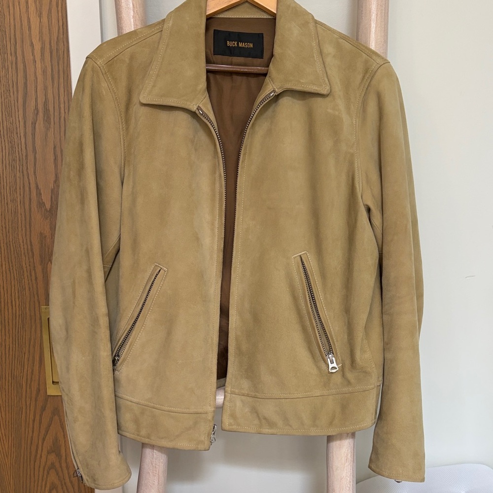 Buck Mason Black Label on Brown Fabric